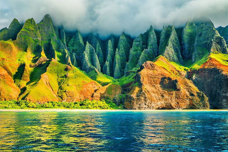 Na Pali makes an unforgettable impression with verdant cliffs surrounding sparkling turquoise water